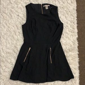 Black romper with gold zippers